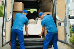 Movers carrying a sofa